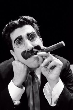 Frank Ferrante as Groucho Marx with the trademark cigar.