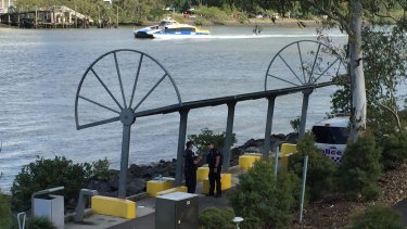 Police at the Brisbane River today where a body has been found.