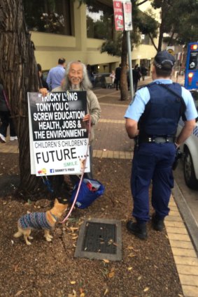 Mr Lim and his dog 'Smarty' were moved on by police on Monday morning.