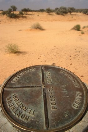 A sign at Poeppel Corner in the Simpson Desert, South Australia.