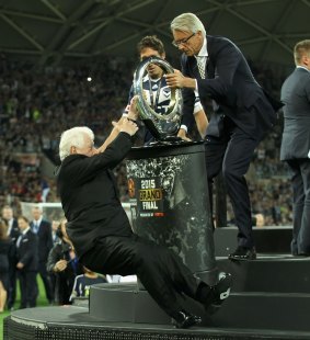 Taking a tumble: Frank Lowy had a spectacular fall at Sunday's A-League grand final.