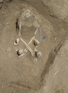 The skeleton of a woman found with a fetal skeleton in her abdomen on the ancient shore of Lake Turkana in Kenya. 