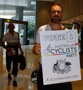 Members of the Australian Cyclists Party arrive at the Legislative Council ballot draw.