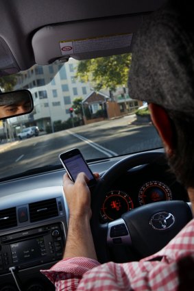Hands off: fewer drivers are being fined for using mobile phones. 