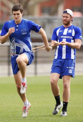 Lachlen Hansen (right) at North Melbourne training on Wednesday morning with Scott Thompson.