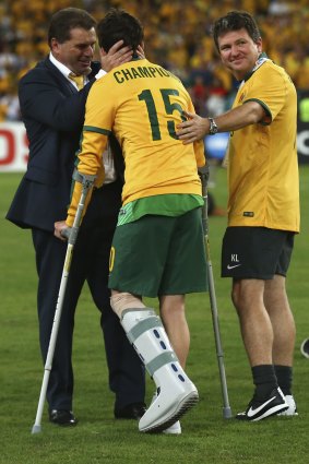 Robbie Kruse is congratulated by coach Ange Postecoglou.