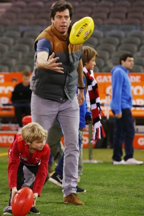 AFL chief executive Gillon McLachlan joins the kick-to-kick after the Swans-Saints match.