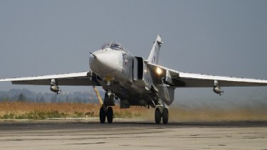 A Russian Su-24 takes off on a combat mission at Hemeimeem airbase in Syria. 