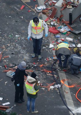 Forensic experts sift through debris in their hunt for evidence a day after a truck ploughed into a crowded Christmas market.