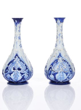 Lot 7: William Moorcroft, Florian Ware Pair of 'Forget-me-not and Leaf' Vases, c.1900. Height 25cm. Price estimate: $2000-$3000