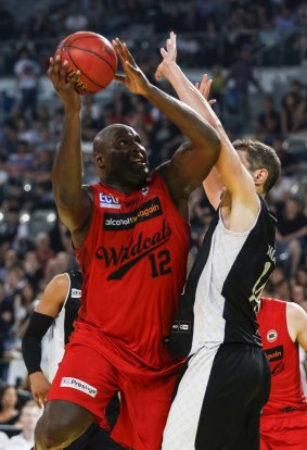 Perth Wildcats' centre Nathan Jawai posts up against Melbourne United's Daniel Kickert.