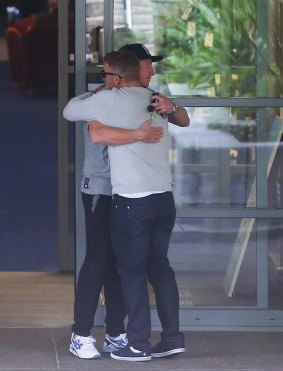 Heartbreaking: Australian cricketers Brad Haddin and Aaron Finch arrive at St Vincent's Hospital in Sydney.