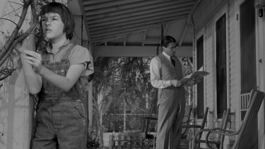 Mary Badham and Gregory Peck as Scout and Atticus Finch in the 1962 movie of <i>To Kill a Mockingbird</i>. 