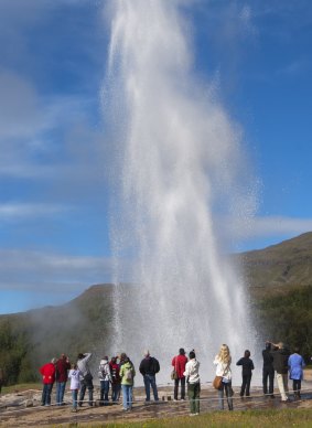 Strokkur geyser erupts on Golden Circle Route.