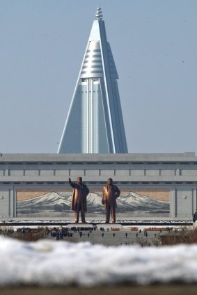Statues of late leaders Kim Il Sung, left, and Kim Jong Il, right, at Mansu Hill near the105-story Ryugyong Hotel in Pyongyang, North Korea.
