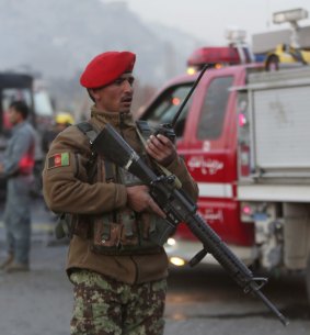 An Afghan soldier at the scene of the suicide attack, the second targeting Afghan forces in the capital in the last week.