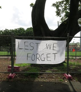 A banner protesting the removal of trees on Anzac Parade.