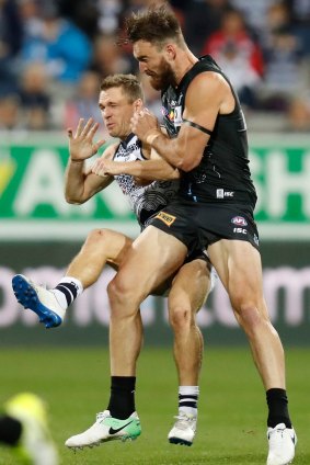Dixon shows Geelong's Joel Selwood a hard time on Thursday before his costly mistake. 