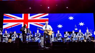 The WA Police Pipe Band on stage with Sir Paul.