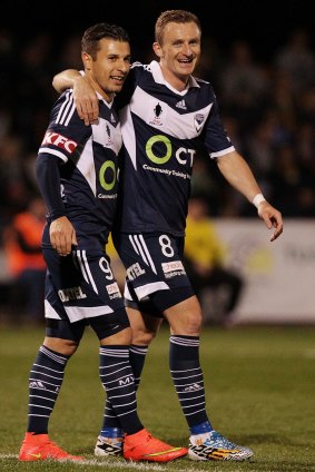 Player of the month Kosta Barbarouses (left) with Besart Berisha.