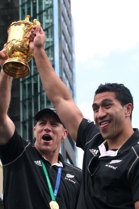 Brad Thorn and Mils Muliaina parade the trophy in 2011.