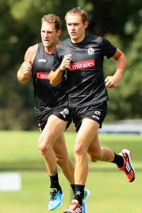 Darcy Moore, seen here with Travis Cloke, was on the cusp of making his AFL debut before sustaining a hamstring injury five weeks ago.