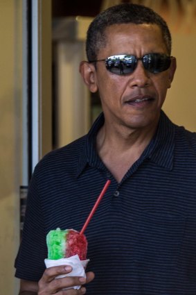 Barack Obama enjoys a shaved ice in Hawaii.