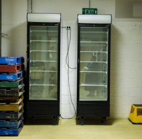 Freezers are being used to freeze books so they can be saved from the flood damage. 