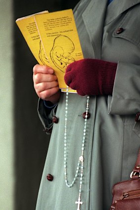 An anti-abortion protester outside a Melbourne clinic.