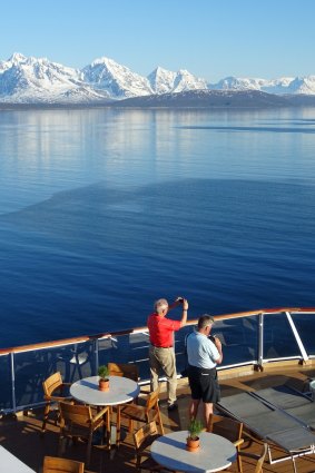 Passengers on the World Cafe deck during the approach to Tromso.
