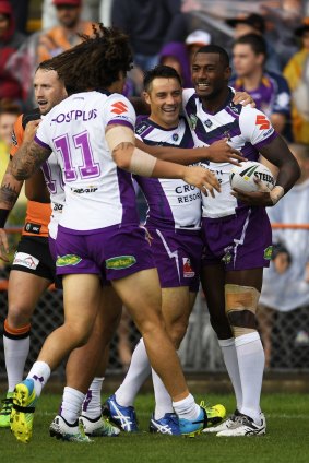 Dream start: Suliasi Vunivalu celebrates one of his two tries with Cooper Cronk.