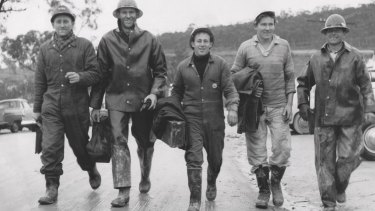 A group of workers return after their day's work in June 1957 on the Snowy Mountains Hydro-Electric Scheme in Adaminaby. 