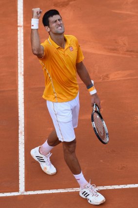 World number one Novak Djokovic of Serbia celebrates his victory over Roger Federer in the Italian Open.