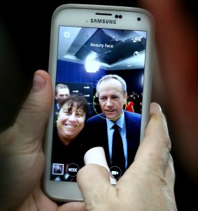 A woman takes a selfie with Opposition Leader Bill Shorten after the peoples' forum.