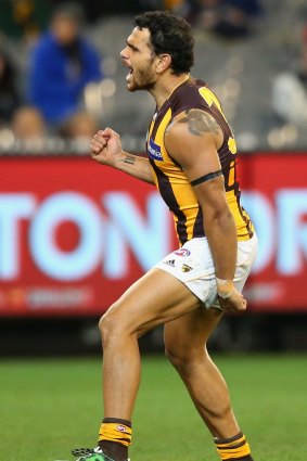 Cyril Rioli celebrates after kicking one of his five goals.