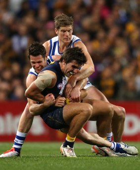 Andrew Gaff, seen here being tackled by Sam Gibson and Nick Dal Santo of the Kangaroos, has been a standout in midfield for the Eagles.