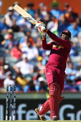 Chris Gayle hits out during his brief innings at the WACA on Friday.