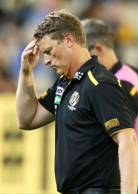 Damien Hardwick leaves the field after speaking to his players.