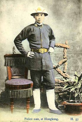 Studio portrait of a policeman in 19th century Hong Kong.