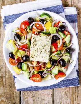 Greek salad of organic vegetables with tomatoes, cucumber, red onion, olives and feta cheese.