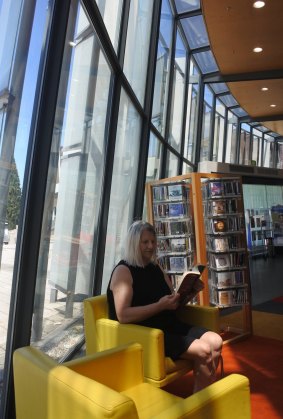 Mila Misic finds a quiet corner in the Civic library on Library Lovers Day on Wednesday.