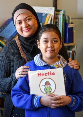 Parent Sabrina Ahmed with her daughter, Nuhad, 8, during a reading group at Belmore South Public School in Sydney.