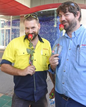 Dean Bissett and Scott Taylor were happy to receive a rose on Valentine's Day from Sexual Health and Family Planning ACT.