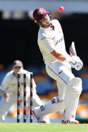 Matthew Renshaw of Queensland ducks under a bouncer during day 2 of the JLT Sheffield Shield match between Queensland and Victoria at the Gabba.