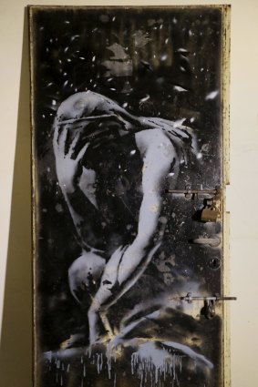 The metal door that depicted a Greek goddess, presumably painted by Banksy.
