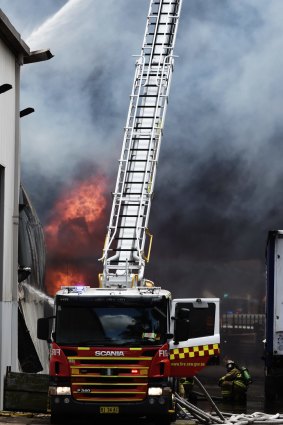 A fire burns out of control in Revesby.