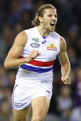 Marcus Bontempelli celebrates after kicking a goal for the Bulldogs at Etihad on Good Friday.