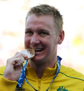 Brenton Rickard with his world championship medal for the 100m breaststroke in 2009.