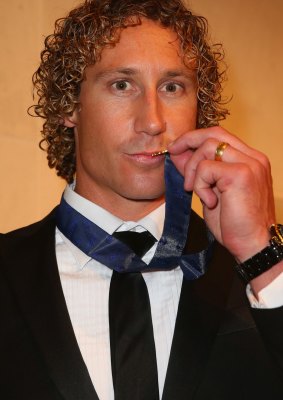 A kiss for Charlie: Matt Priddis lifts his Brownlow Medal to his lips after the presentation ceremony on Monday night.