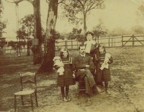 Edith Coleman with her family in their Blackburn backyard, ca 1910.